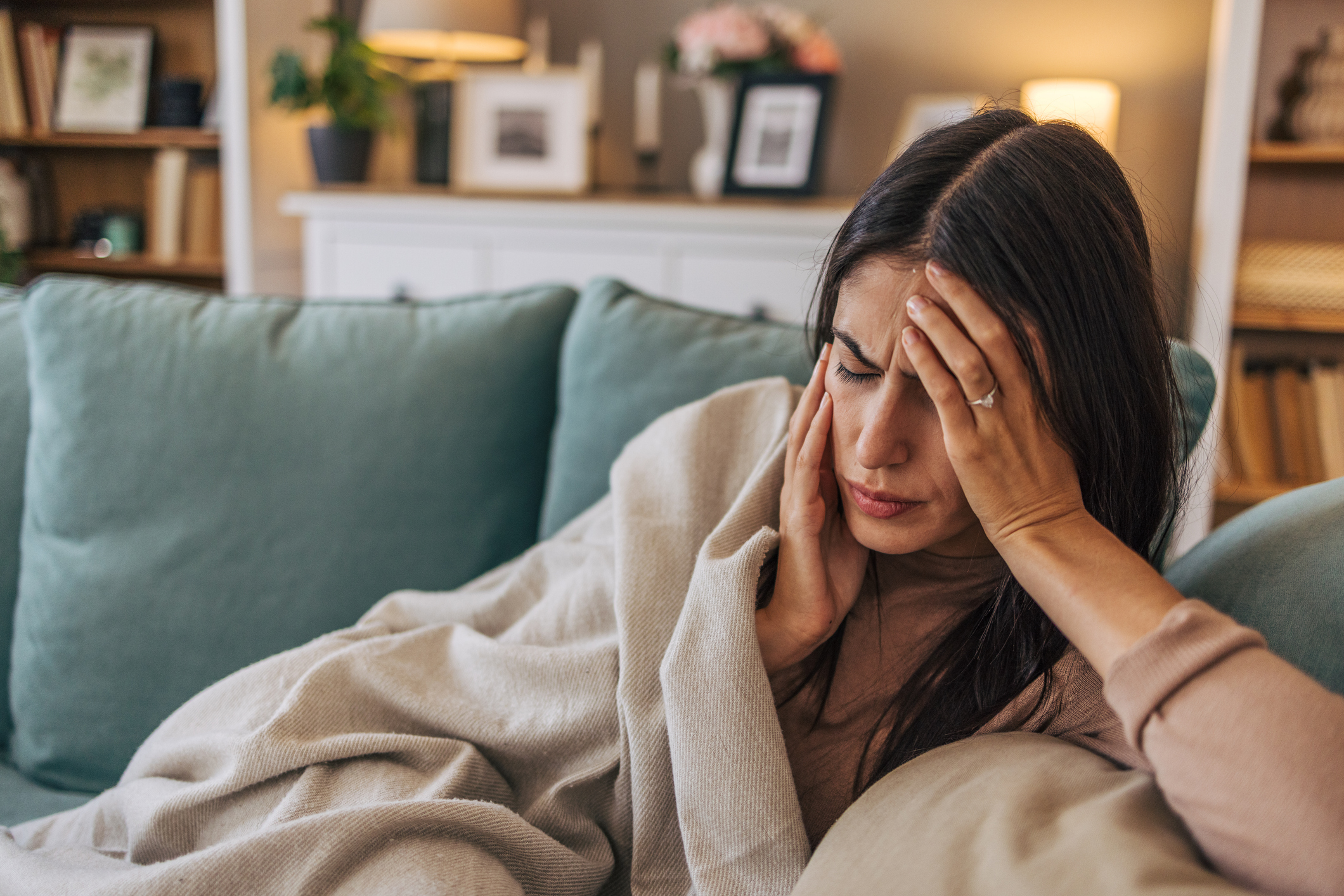 Person suffering from headache migraine pain needing treatment in Salinas chiropractic clinic
