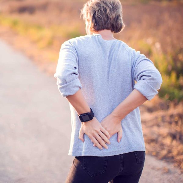 Person with hip pain needing specialized chiropractic treatment in Salinas